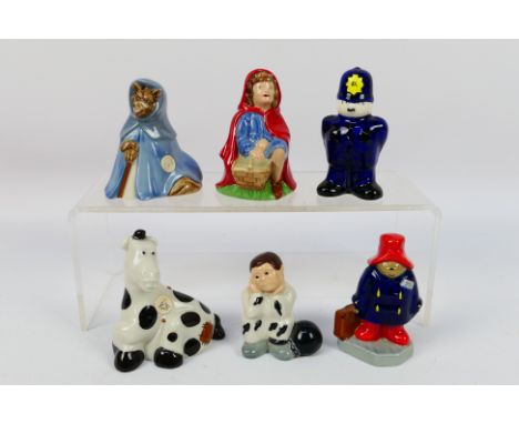 A collection of Wade figures to include Red Riding Hood and The Big Bad Wolf, Pantomime Horse, Paddington, Prisoner and Polic