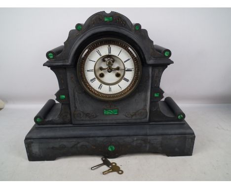 A French black marble mantel clock of architectural form with malachite inlays and incised gilded decoration, 8-day bell stri