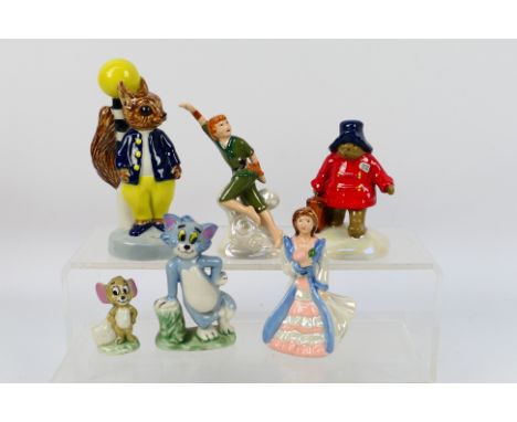 Wade - A collection of figures to include Paddington, Peter Pan, Tom and Jerry, Tufty and other, largest approximately 14 cm 