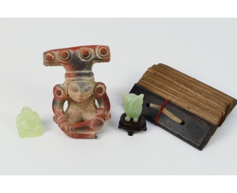 Lot to include two small green stone carvings, a pottery figure and a palm leaf manuscript with wooden covers. [W]