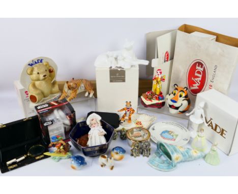 Lot to include a boxed Royal Doulton Classics figure, various Wade pieces, tiger figure and other, also a quantity of empty W