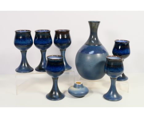 A vintage Iden Pottery wine set comprising decanter and stopper and six goblets, stamped to the base, decanter approximately 