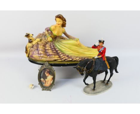 A limited edition Country Artists model, Trooping The Colour with a painted plaster group depicting a lady and a canine, larg