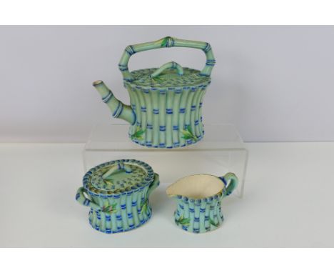 A Victorian three piece Wedgwood faux bamboo tea service, moulded as flowering bamboo with a light blue glaze comprising teap