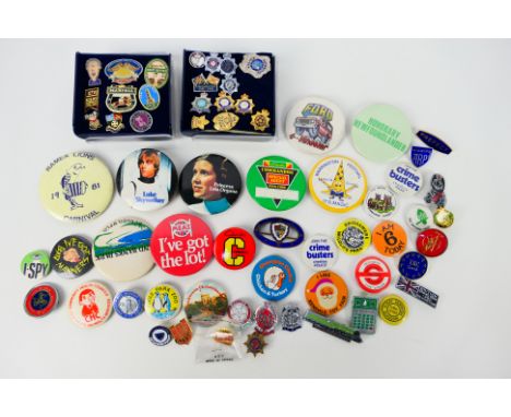 A collection of vintage pin badges to include Star Wars, TT Races, Ford, Police related and other. [W]