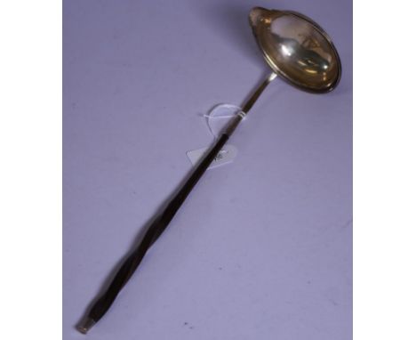 George III sterling silver toddy ladle hallmarked for London 1793, with decorative baleen handle. (Length 31cm approx).