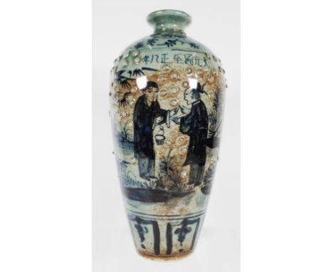 Chinese ceramic mantle vase blue and white decoration of figures in a garden, script in characters to side. (Height 24cm appr