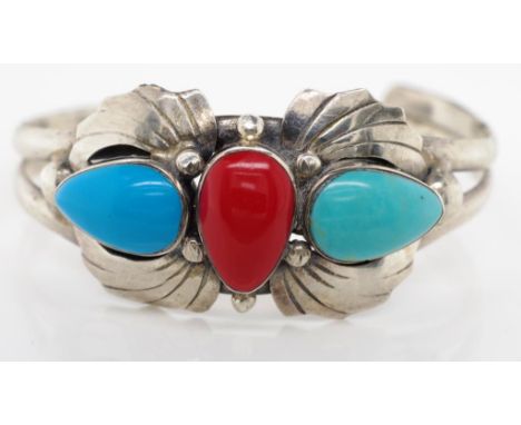 Sterling silver bangle set with decorative turquoise, and red coloured drop cabochons. Marked 925 Approx inside width 58mm .