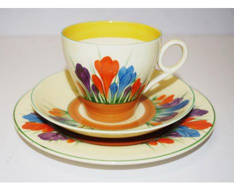 Clarice Cliff ceramic trio cup, saucer and plate, Crocus pattern, marked to bases.