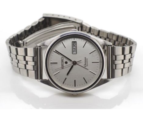 Vintage Seiko alarm watch Chronos quartz, steel case and bracelet. Day date, Approx 34mm case width ex crown. Running when te