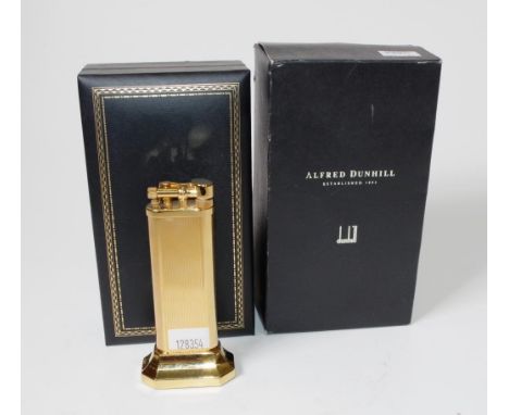 Cased Dunhill gold plated table lighter marked to base and # 25572, in presentation case, (height 10cm approx).