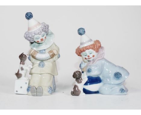 Two Lladro clown figures each clown figure, with a dog. Marked to bases. (Height 12cm, and 15cm approx).