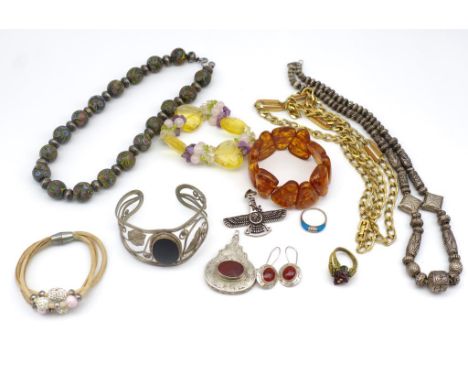 Silver and costume jewellery group includes a Assyrian Ashur pedant, a ring bangle, necklaces etc.