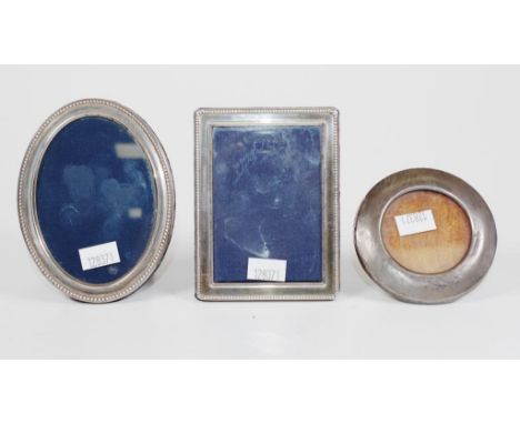 Three various small silver photo frames including vintage hallmarked silver circular frame, (diameter 7.5cm approx); Sheffiel