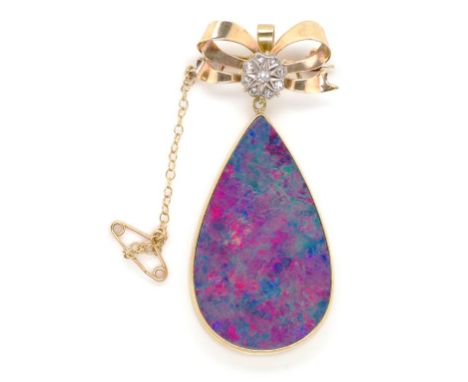 Antique gold, diamond and opal brooch handmade hanging brooch with a gold ribbon form top set with 9x old cut diamonds. The b