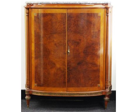 Vintage Italian bow fronted cabinet with two doors and a marble top. The interior has three shelves over one long drawer. Tur