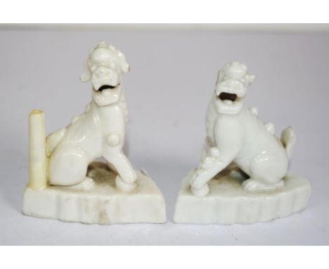 Pair Chinese white ceramic Foo Dogs (Height 8cm approx, each).