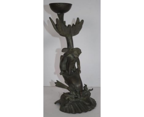 Vintage cast metal cherub on a dolphin candlestick height 25cm approx