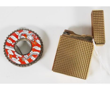 Dupont Paris gold plated cigarette lighter marked to base and # EK3096; together with an enamel and silver circular brooch.