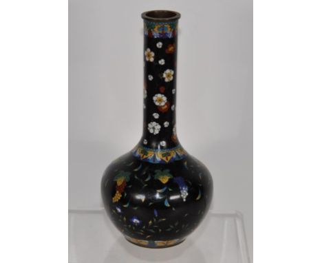 Vintage Japanese cloisonne vase blossom decorated on dark ground. (Height 22cm approx).