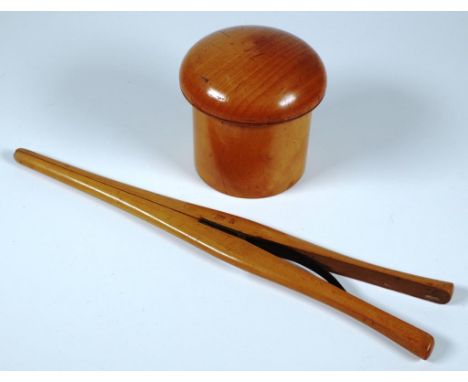 Early treen boxwood lidded container (height 9cm approx); together with a vintage pair of wood glove stretchers.