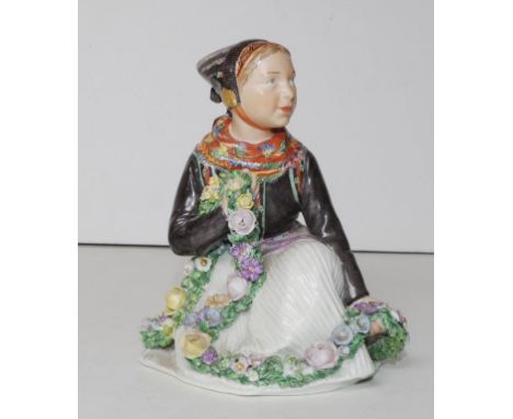 Vintage Royal Copenhagen Amager girl figurine in traditional dress, No.12412, 13cm high approx. Losses to flowers.