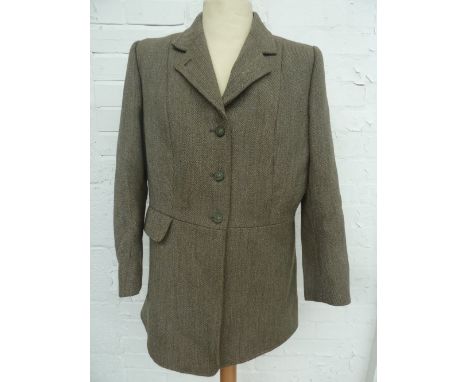 A ladies autumn hunting coat in tweed, lined with Tattersall check cloth, size 16, made by "The Hunting Stock Market", Dorset