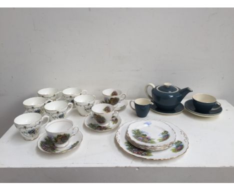 A teal colour Poole pottery set including  a tea cup, two side plates, a milk jug and a tea pot,  six Salisbury tea cups with