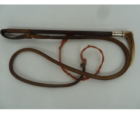 A child's or ladies hunting whip by Swaine, London with antler handle, silver collar  (marks rubbed), plaited leather shaft 4