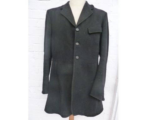 A gent's black hunting coat with three buttons to the front made in 1954 in Sherborne by John Hazzard & Son with Blackmore Va