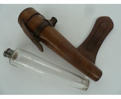 A glass and silver-mounted saddle-flask possibly Swaine & Adeney Ltd. London, of tapered form, with brown leather case and st