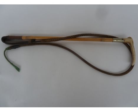 A gent's hunting whip made of bamboo with metal collar, antler handle, leather thong and lash