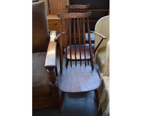 Two Ercol spindle back dining chairs including one carver (2)