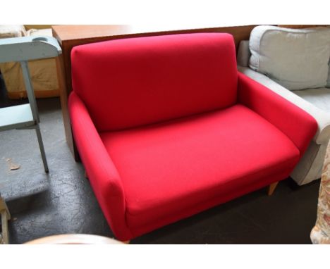 A John Lewis red upholstered two seater sofa with turned splayed legs 119 x 80 x 80cm