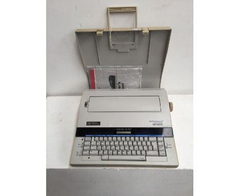 A Smith Corona typewriter, Model 5PEF with owner's manual