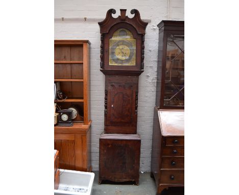 An early 19th century mahogany longcase clock with eight day movement brass face and silvered chaptering signed Barrow Bradfo