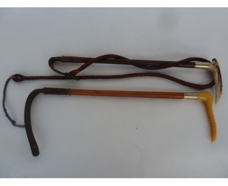 A Swaine child's hunting whip with antler horn grip, metal collar, plaited shaft and leather thong with lash together with a 