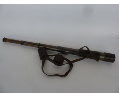 A brass 5 Drawer Spotters Stalking Telescope with Original Leather Case and Straps. Length Fully Extended 41.5 Inches possibl