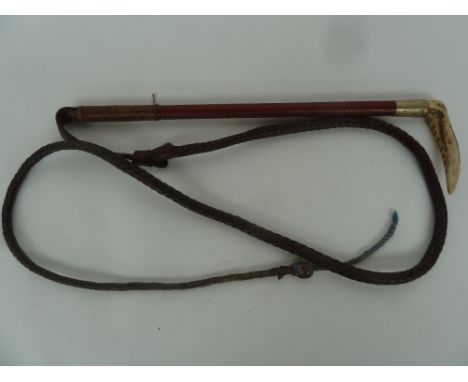A hunting whip 50cmL made by Swaine and engraved Nigel B. Farmer with leather thong