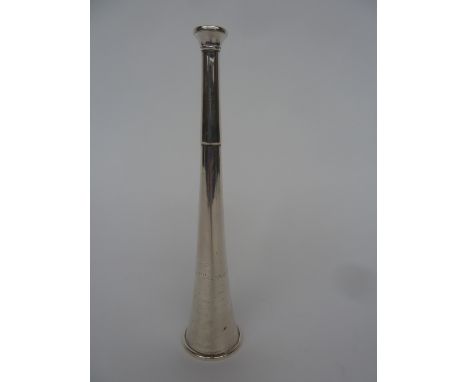 A Victorian silver hunting horn,by Swaine Adeney, London 1864, of usual form, inscribed 'Presented to C.J.Thursby Esq. by Hol