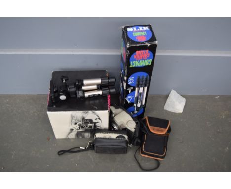 A quantity of cameras including a Canon Sure Shot Autofocus in carry case, a Kodak Instamatic in carry case, a Super Swinger 
