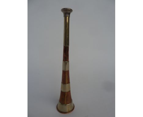 A Swaine & Adeney Copper Hunting Horn, with nickel silver mouthpiece and bands, stamped `Swaine & Adeney, London, Proprietors