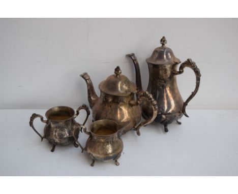 A quantity of silver plated items including a teapot, coffee pot, milk jug and sugar pot with twin loop handles with incised 