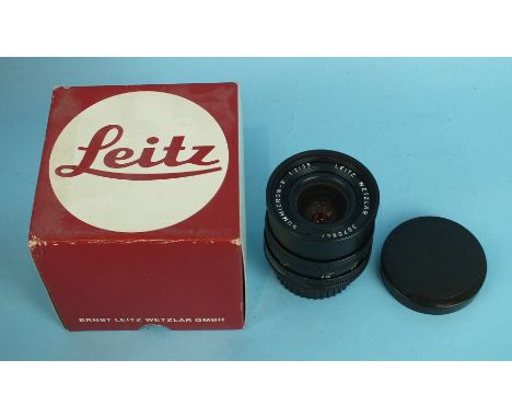 A Leica Summicron-R 1:2 35mm lens no.3070647, bayonet fitting, boxed with Leica passport dated 31.12.82 and warranty card.