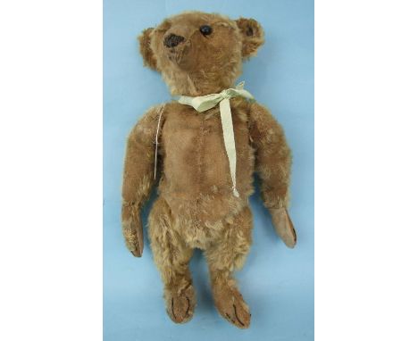 Steiff, an early-20th century honey mohair Steiff teddy bear with 6mm 'Steiff' button, ('f' tail, arched back to 'e') in ear,