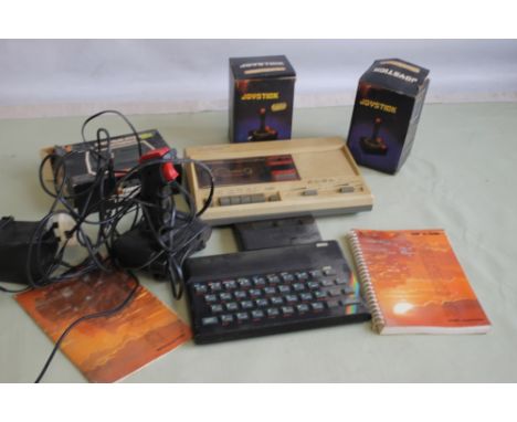 A VINTAGE "SINCLAIR ZX SPECTRUM" with"Ram Turbo" together with a small quantity of accessories and an instruction manual and 