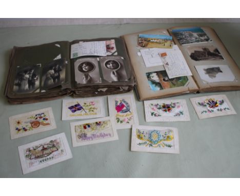 AN EDWARDIAN POSTCARD ALBUM AND CONTENTS to include a good selection of portrait beauties, along woth another album of miscel