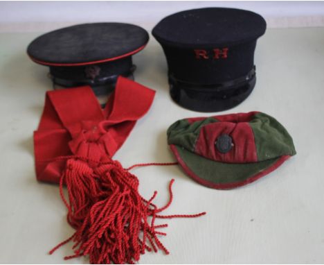 AN OFFICER'S DRESS CAP WITH WORCESTERSHIRE REGIMENT BADGE, a railway cap, a jockey's silk cap and a sash