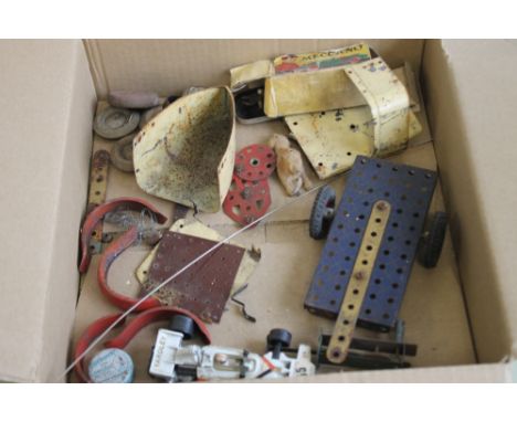 A QUANTITY OF MECCANO PIECES WHICH FORM PART OF A 1930S TINPLATE RACING CAR  A/F together with an instruction leaflet