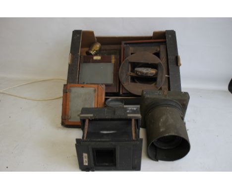 A TRAY OF PHOTOGRAPHIC EQUIPMENT to include magic lantern parts, plate holders etc.